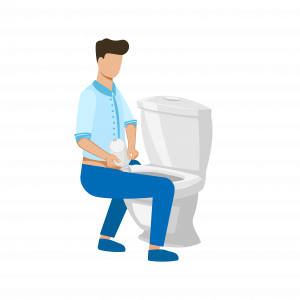 Chłopiec siedzący na toalecie do góry nogami podczas opróżniania worka stomijnego